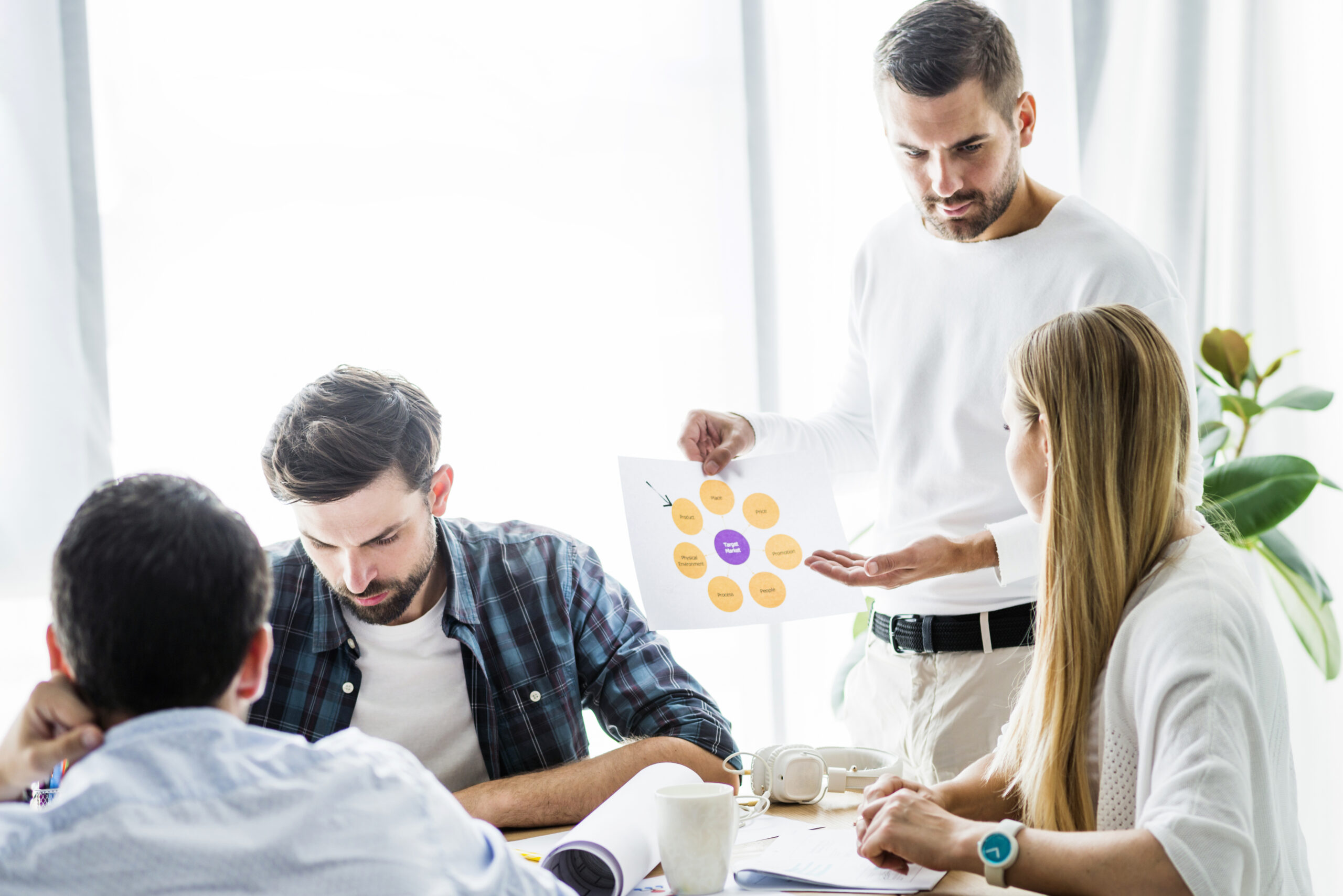 businessman showing chart his female employee workplace scaled businessman showing chart his female employee workplace scaled